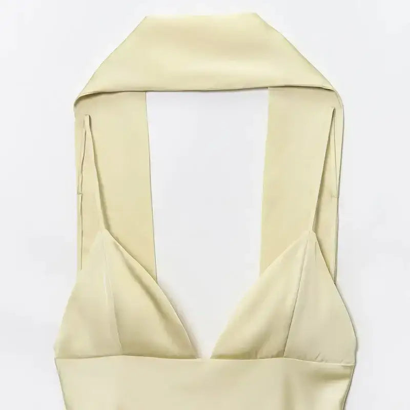 Close-up of cream sleeveless satin formal dress top with halter neck style