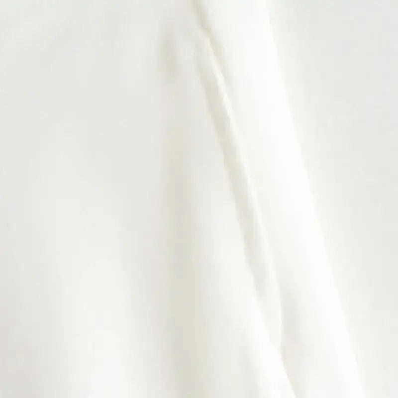 Close-up detail of soft white fabric for summer office vest and shorts outfit from The Lady's Haven Boutique