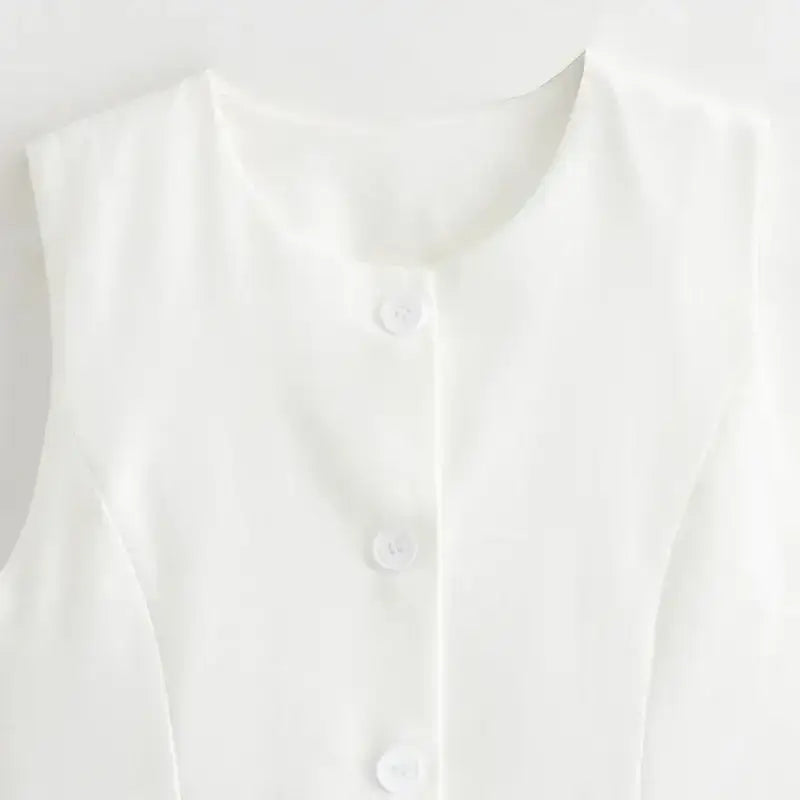 White sleeveless buttoned summer office vest and shorts outfit from The Lady's Haven Boutique