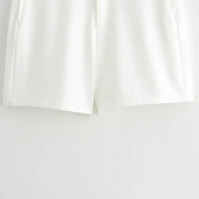 White shorts detail from summer office vest and shorts outfit by The Lady's Haven Boutique