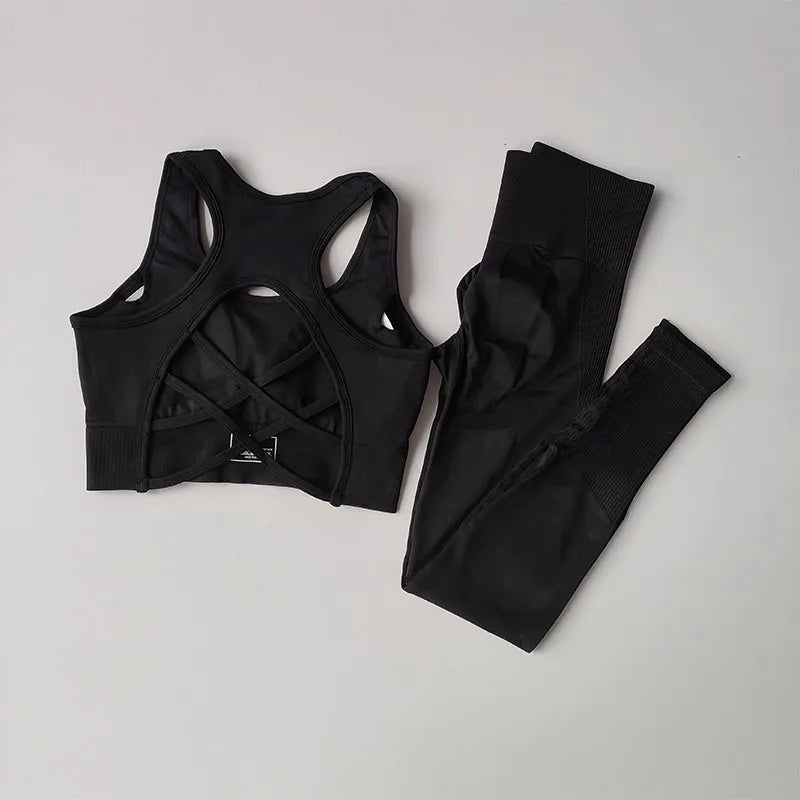 Womens yoga set tracksuit in black featuring a stylish cross-back sports bra and matching leggings