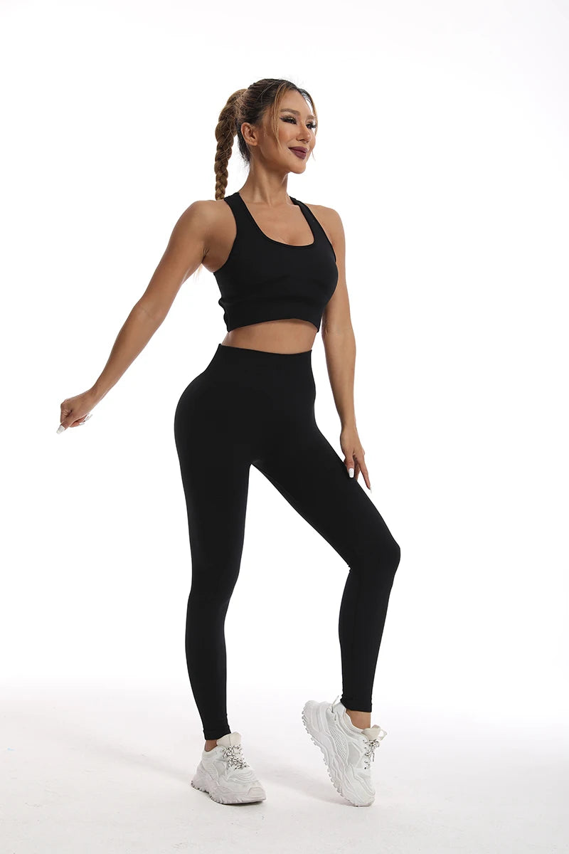 Stylish black womens yoga set tracksuit featuring a crop top and high-waisted leggings for comfort and flexibility