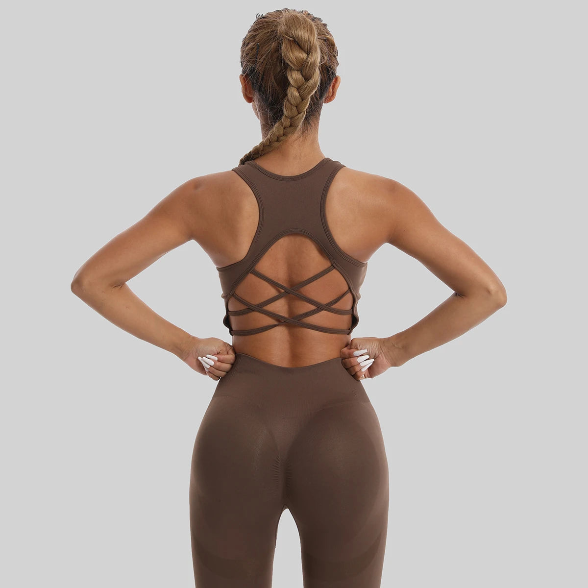 Womens yoga set tracksuit in brown with stylish crisscross back design for comfort and flexibility