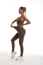 Womens yoga set tracksuit in brown featuring a fitted sports bra and high-waisted leggings