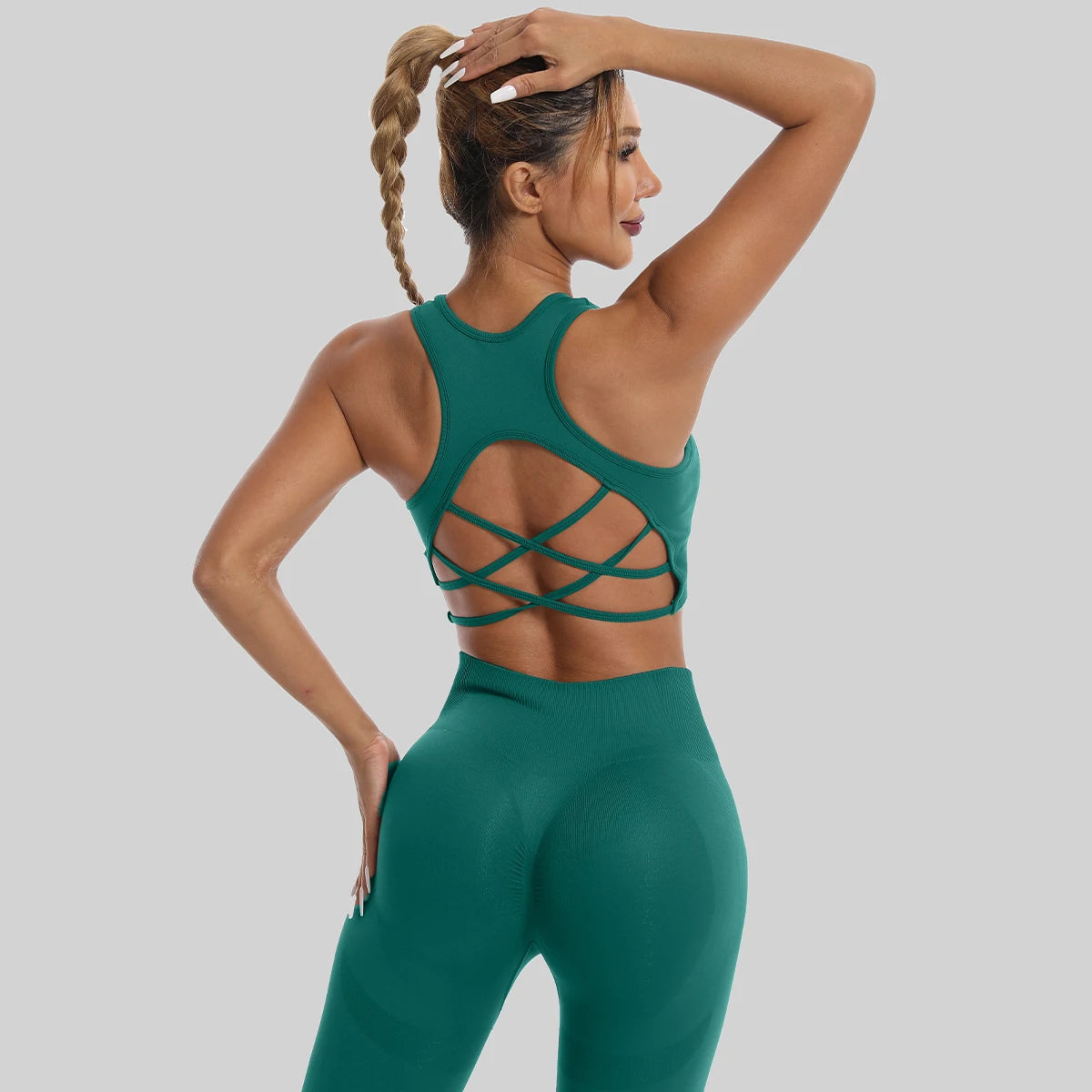 Womens yoga set tracksuit in green featuring a stylish crisscross back design for comfort and style