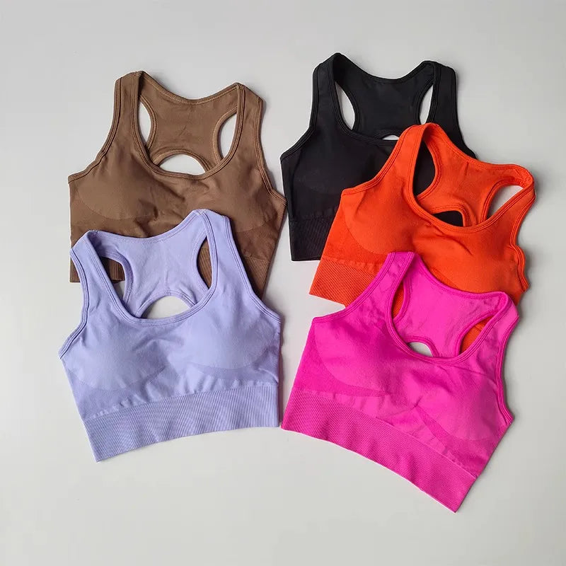 Colorful womens yoga set tracksuit featuring sports bras in pink, orange, purple, black and brown