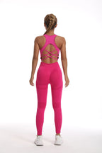 Back view of a pink womens yoga set tracksuit featuring a stylish crisscross design and fitted leggings