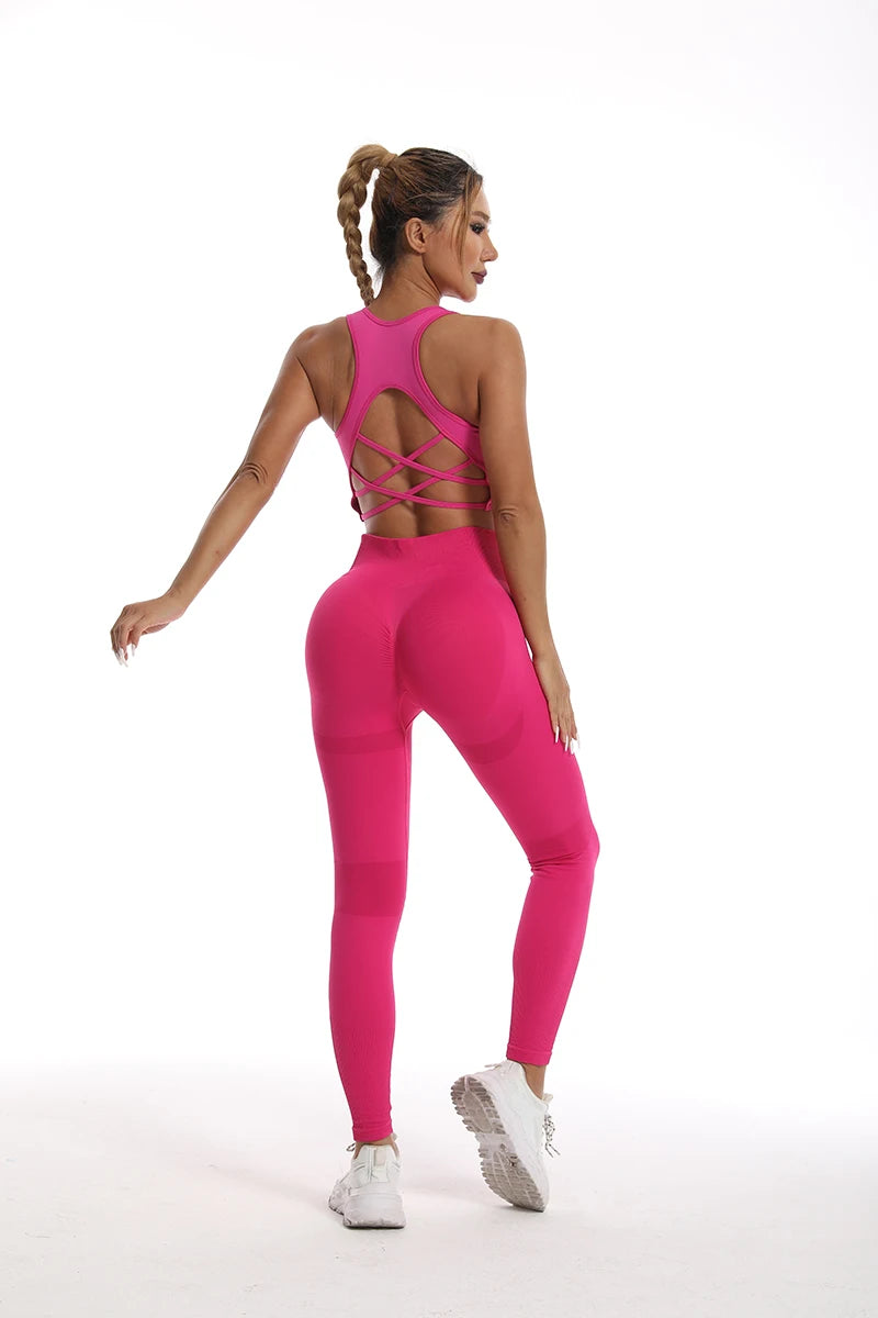 Hot pink womens yoga set tracksuit featuring a stylish crisscross back design