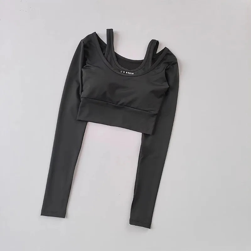 Black workout t-shirt with pads featuring long sleeves and a cropped design