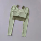 Light green workout t-shirt with pads featuring long sleeves and a cropped design