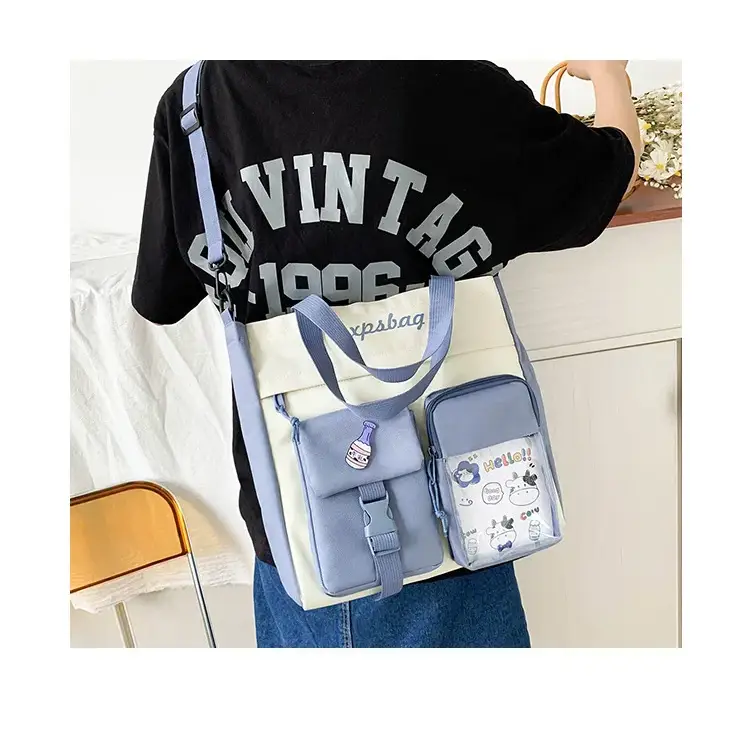 Large capacity ladies handbag in blue and cream with adjustable strap and multiple pockets