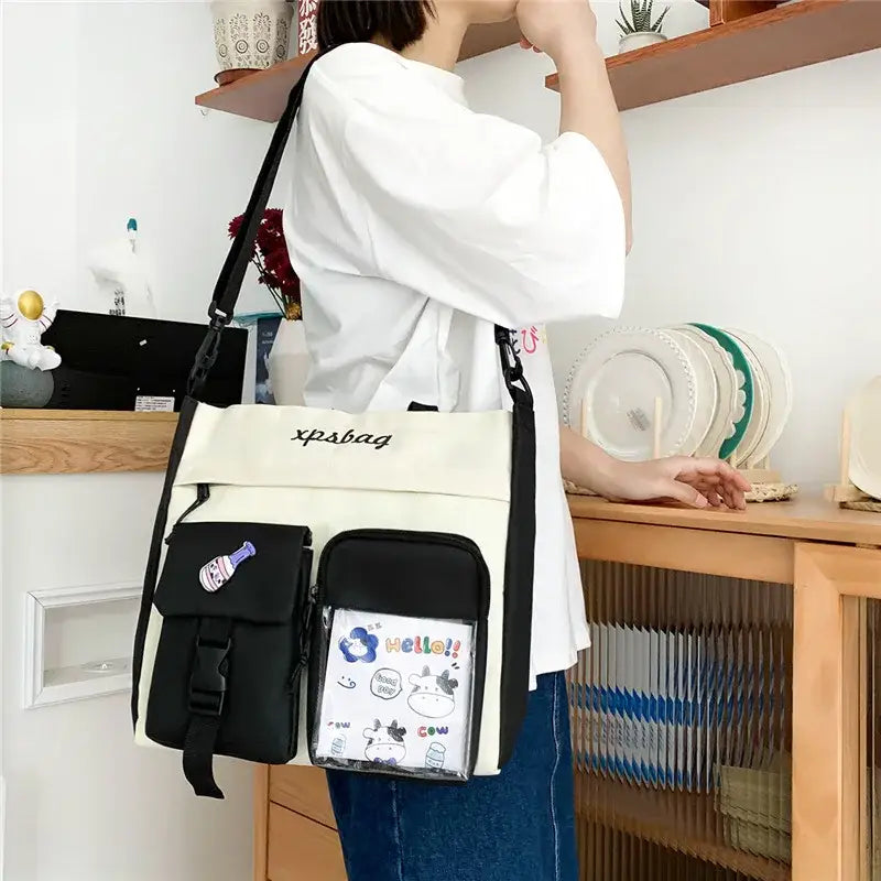 Stylish large capacity ladies handbag in cream with multiple pockets and adjustable strap