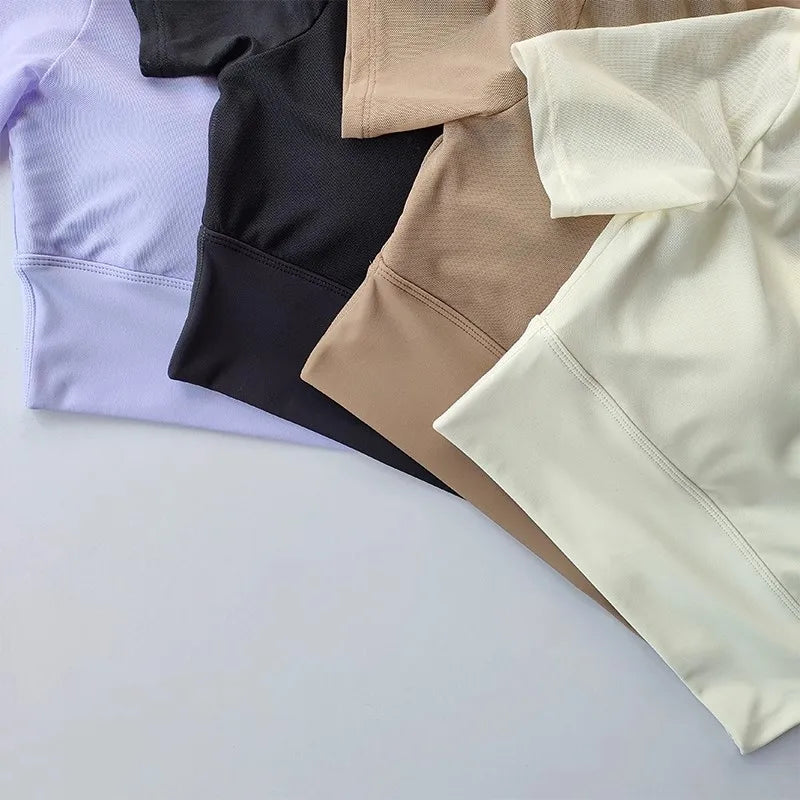 Assorted yoga clothes for women in lavender, black, beige, and cream fabrics