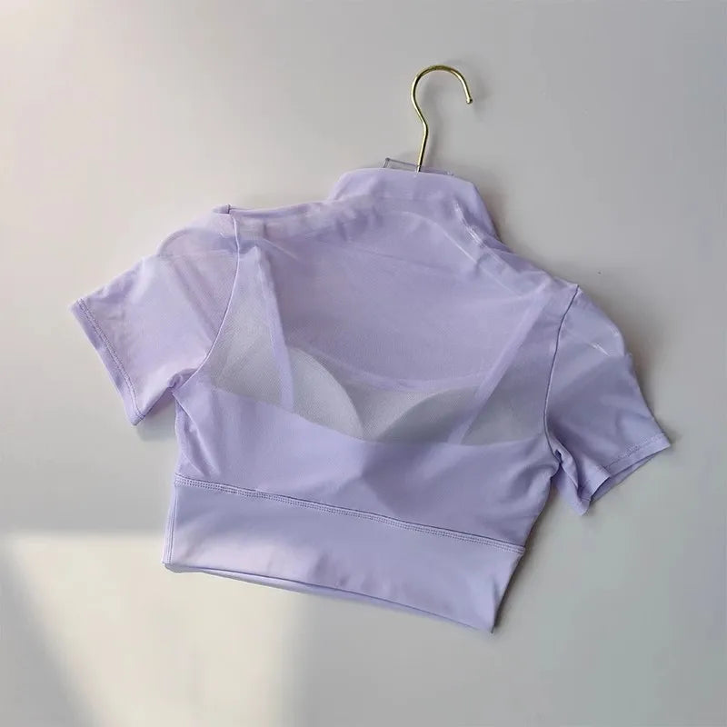 Light purple cropped yoga clothes for women with mesh detailing for comfort and style