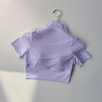 Women's lavender yoga clothes for women featuring a trendy cropped design and breathable mesh fabric.