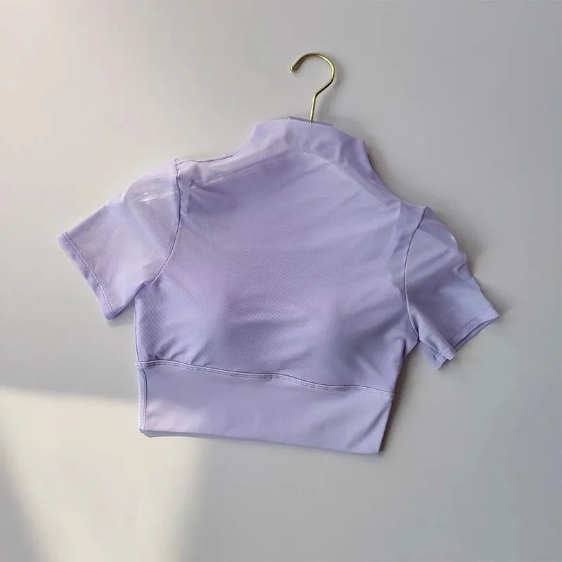 Women's lavender yoga clothes for women featuring a trendy cropped design and breathable mesh fabric.