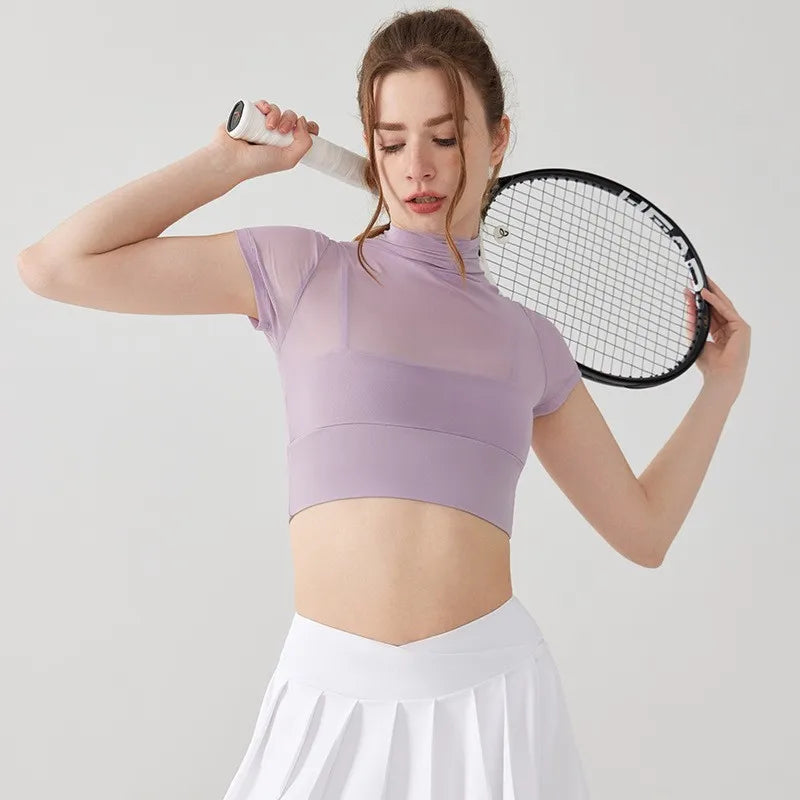 Light purple crop top for women paired with a tennis racket, ideal yoga clothes for women