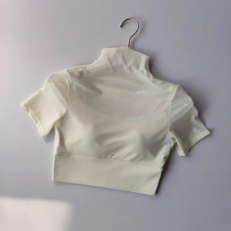 White cropped yoga top with a high collar, perfect for yoga clothes for women
