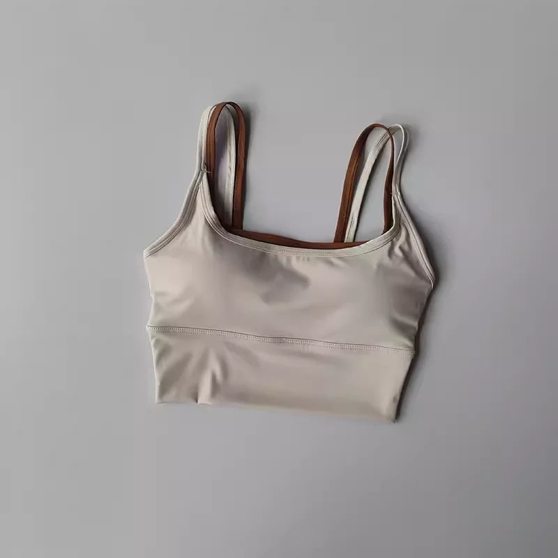 Light beige yoga crop top for workout with adjustable straps for maximum comfort and flexibility