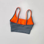 Yoga crop top for workout in gray and orange with adjustable straps for comfort and support