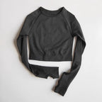 Black cropped yoga fitness tops for women with long sleeves and breathable fabric for workouts
