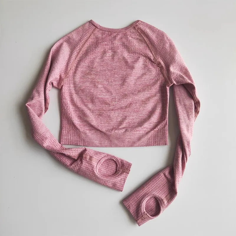 Pink long-sleeve back view of yoga fitness tops for women with textured fabric and thumbholes