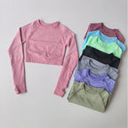 Assorted yoga fitness tops for women in various colors including pink, blue, green, and gray