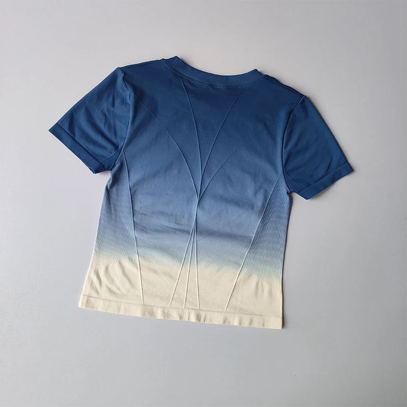 Back view of yoga top and shorts gradient for women in blue and cream colors
